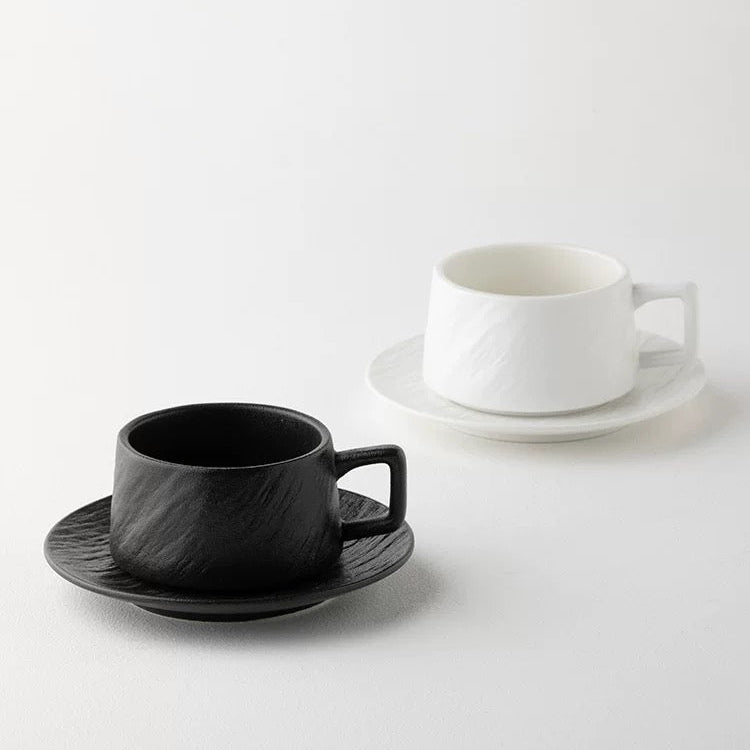 Two coffee cups on saucers