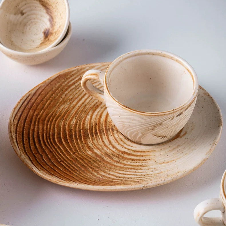 Ceramic cup and saucer set on a white surface