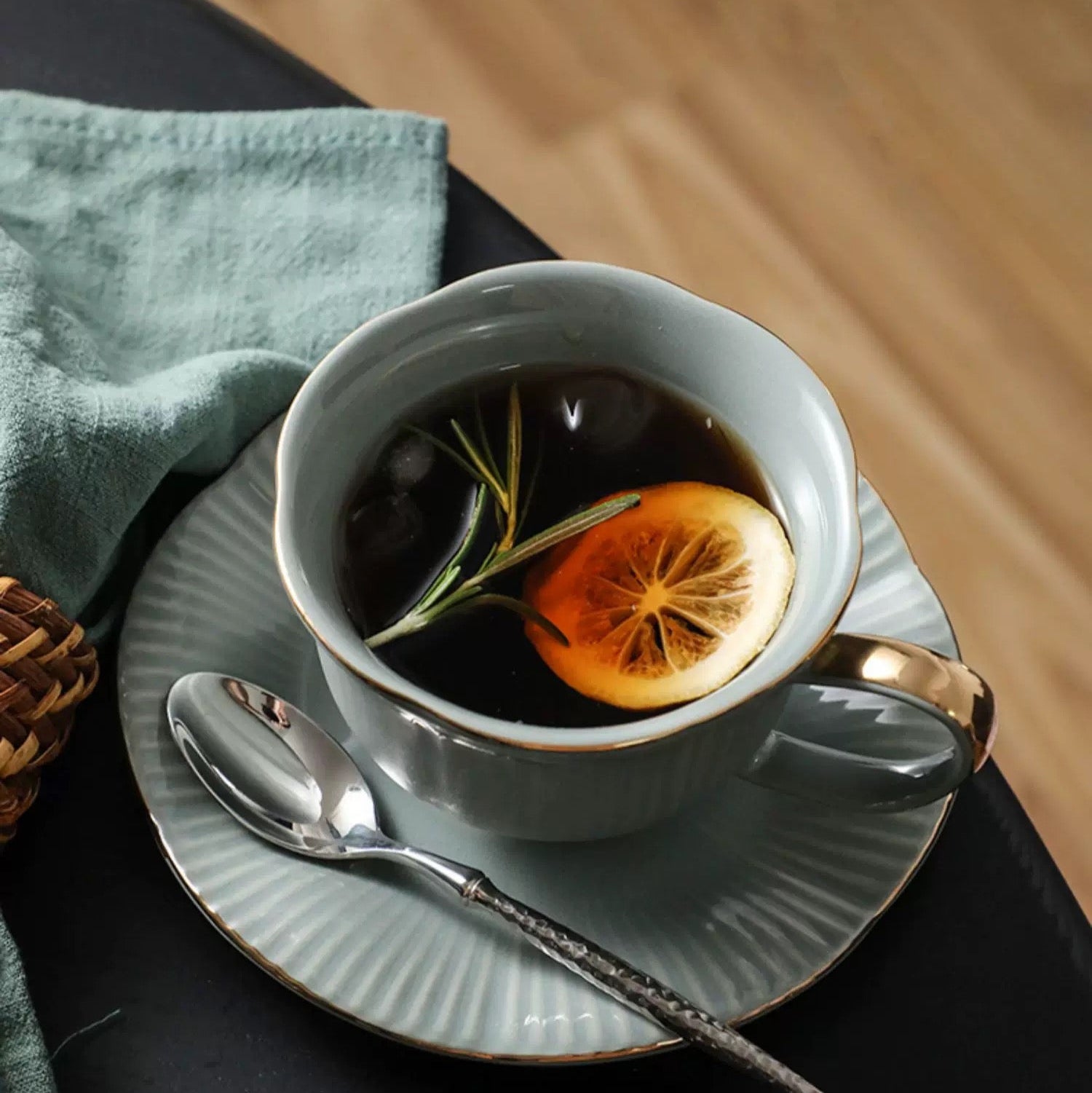 Ceramic cup with tea and lemon slice on a saucer 