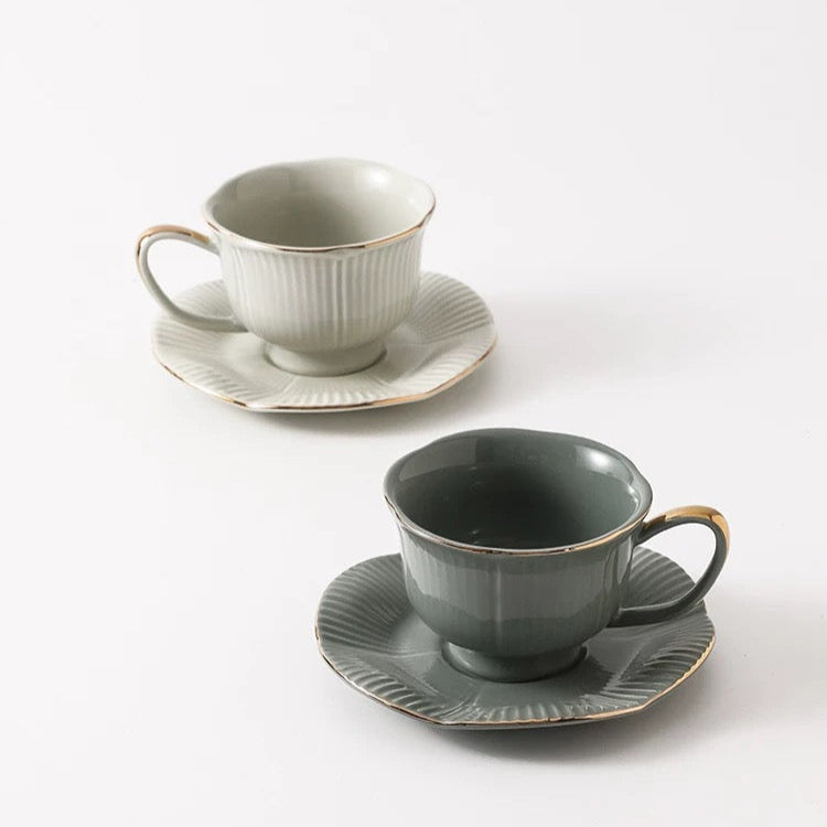 gold-detailed rim, sage green/cream cup
