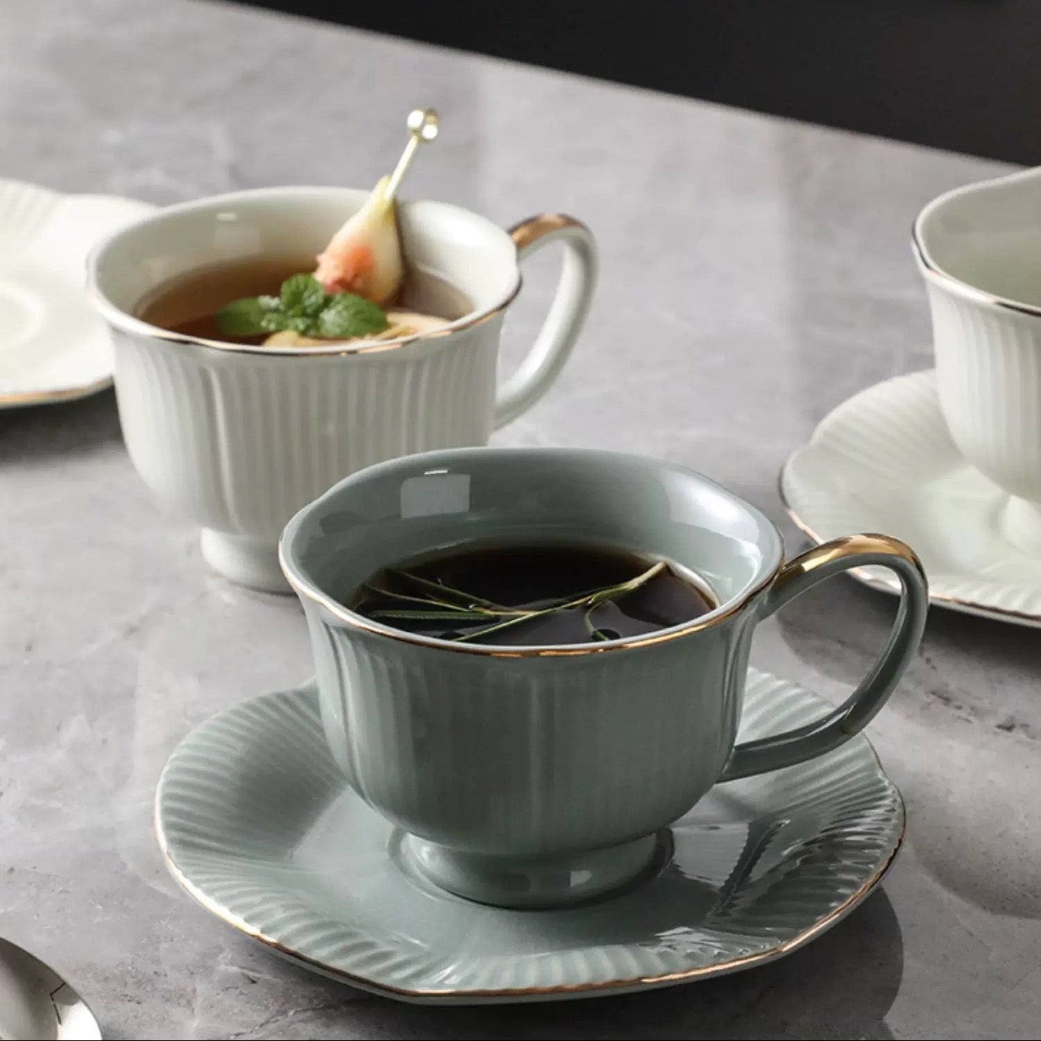 Teacup and saucer set on a marble surface