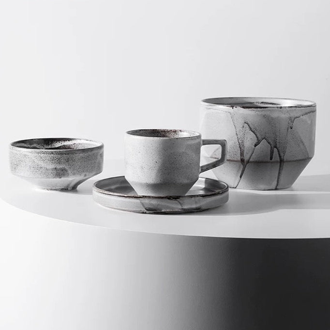Set of ceramic cups and saucers on a white surface with 'Chiba Metal Works & Design' branding.