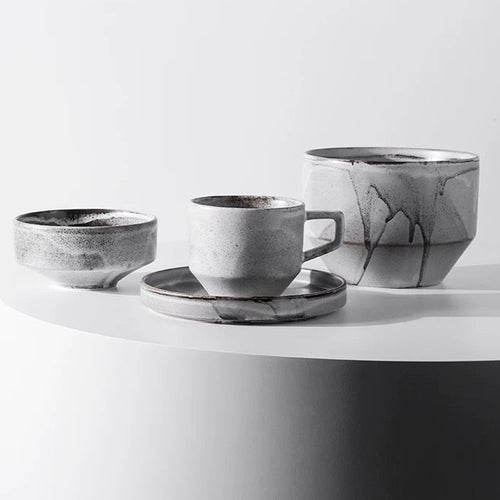 Set of ceramic cups and saucers on a white surface with 'Chiba Metal Works & Design' branding.