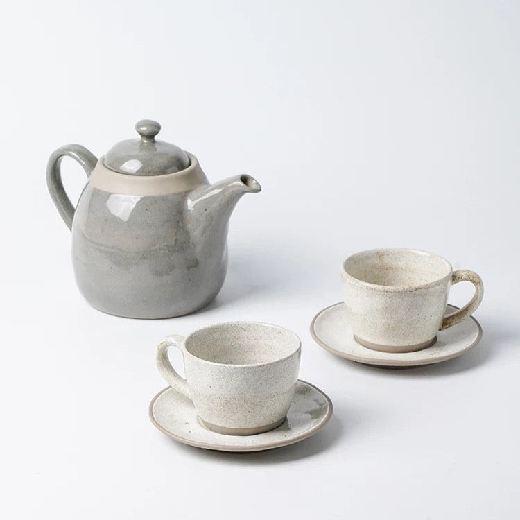 Ceramic tea set with teapot and cups on a white background, featuring the brand 'Alaniz'.